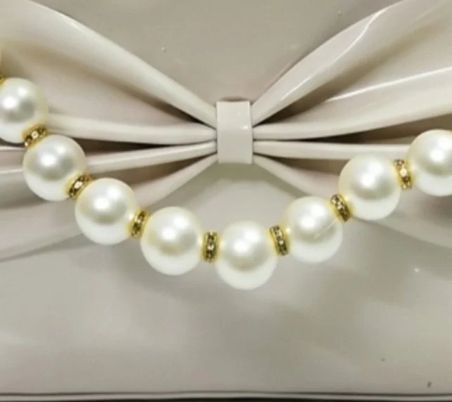 The Patent Bow Bag - Bow & pearl detail
